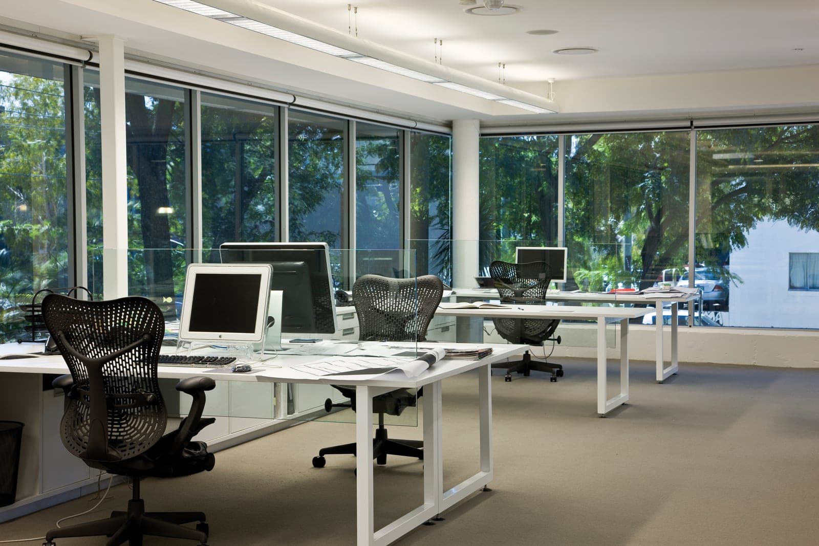 Open-plan office with floor-to-ceiling filmed glass