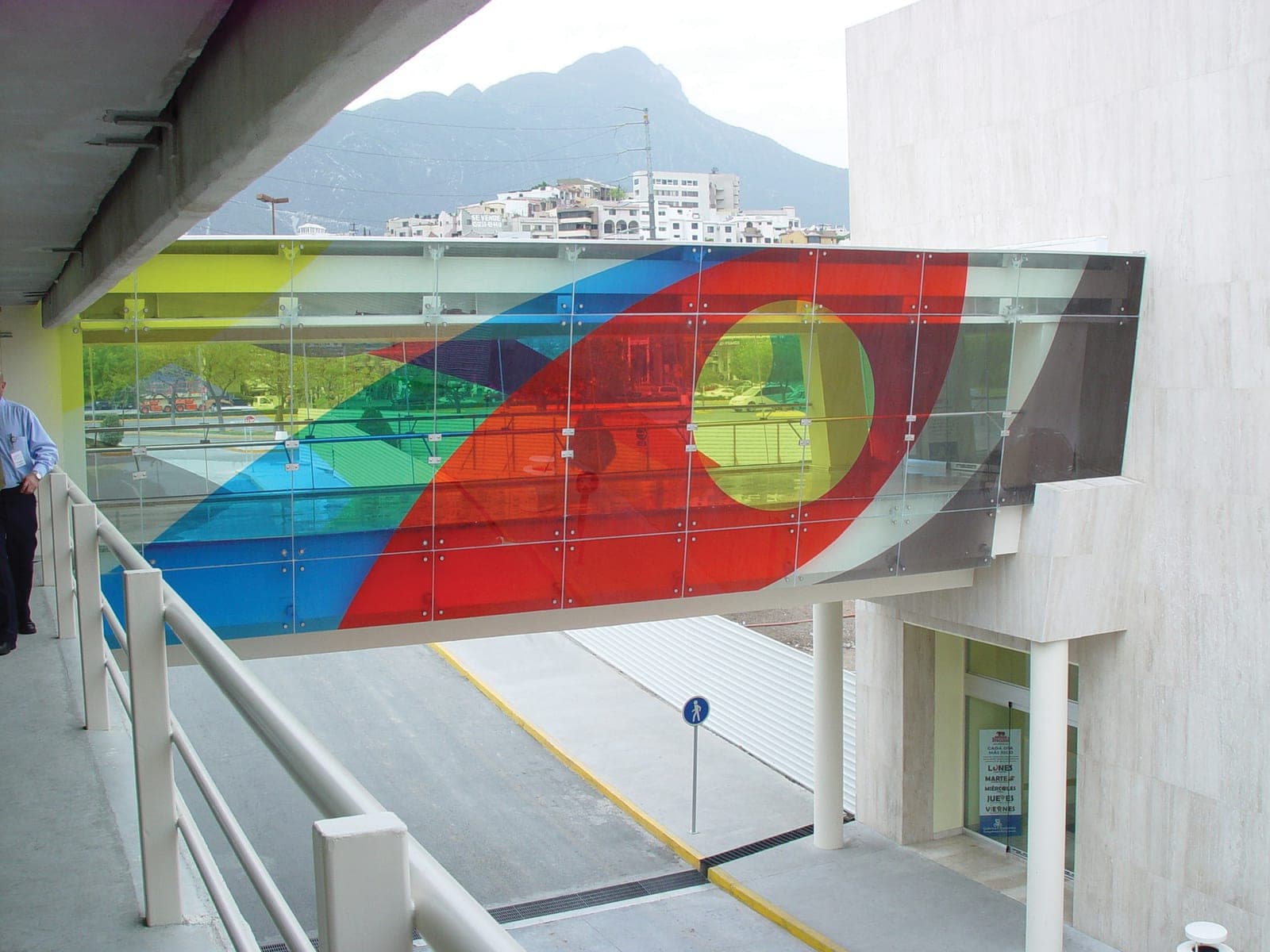 Vibrant translucent color film on an architectural glass walkway